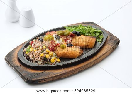 Hot Platter Of Filling Wrapped In Two Cripsy Corn Tortillas Topped With Cheese