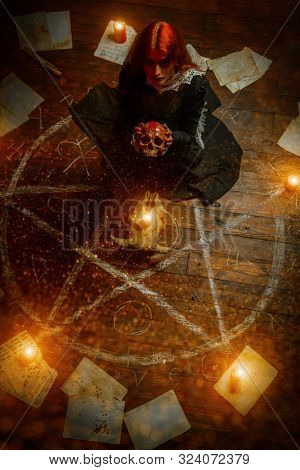 A portrait of a scary witch in the wooden house. Magic, dark force, spell. 