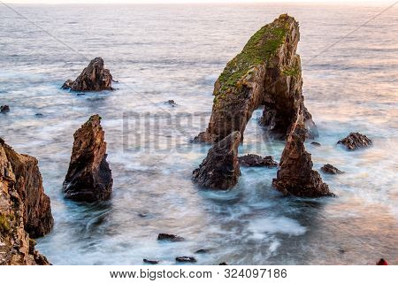 Long Tme Exposure Of Crohy Head Sea Arch Breeches During Sunset - County Donegal, Ireland