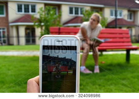 The Phone Takes Pictures Outdoor. Photographer Outdoor