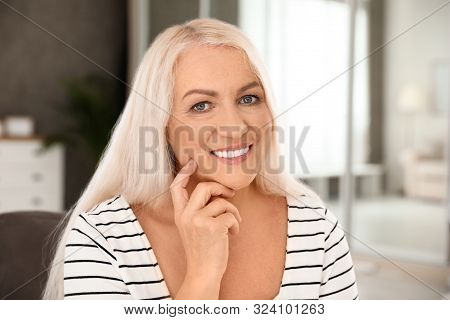 Portrait Of Mature Woman With Beautiful Face Indoors