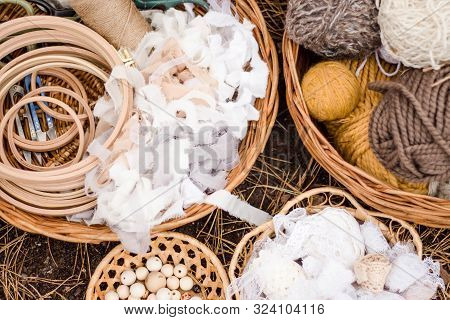 Four Multi-colored Woolen Threads, Rolls Of Beige And Gray Cotton Lace, Wooden Beads In Wicker Ratta