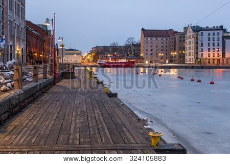 Helsinki, Finland- 28 February 2015: Wooden Catwalk Along Kanavaranta Street In Helsinki Marina. Red