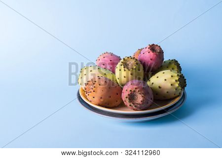 Whole Fresh Prickly Pear Fruit In A Plate On A Pastel Blue Background Backdrop. Prickly Pear Or Fich