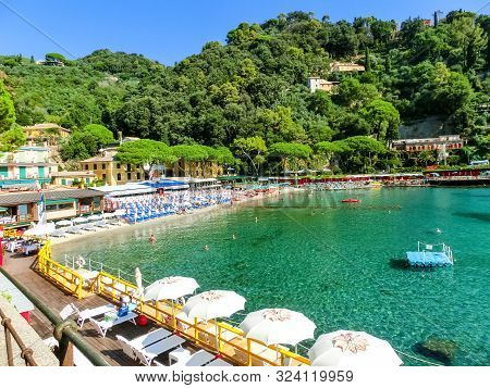 The Sand Beach Known As Paraggi Near Portofino In Genoa On A Blue Sky And Sea Background