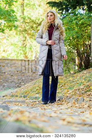 Jacket Everyone Should Have. Puffer Fashion Trend Concept. Girl Fashionable Blonde Walk In Autumn Pa
