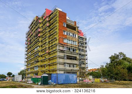 Scaffolding Arround The House To Install Thermal Insulation Of The Apartment Building Facade