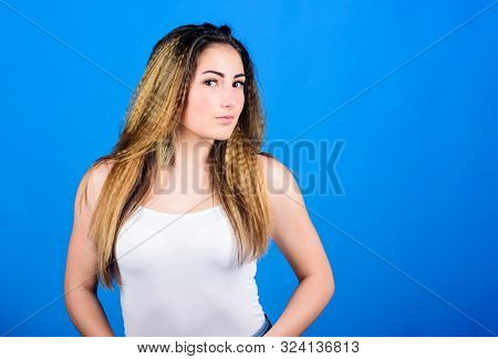 Styling Cosmetic Product. Crimped Hairstyles. Woman Stylish Hairstyle On Blue Background. Hair Crimp