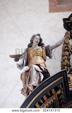 BRONNBACH, GERMANY - JULY 07, 2018: Angel, statue on the altar of the Holy Cross in Cistercian Abbey of Bronnbach in Reicholzheim near Wertheim, Germany