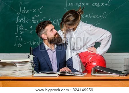 Intellectual Intimacy. Sexy Woman And Bearded Man Feeling Intimacy In Class. Intimacy Between Teache