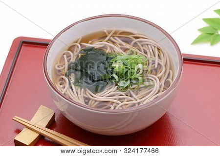 Japanese Kake Soba Noodles In A Ceramic Bowl With Chopsticks On Tray