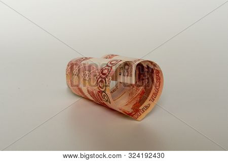 5000 Rubles. Red Bill 5 Thousand Rubles In The Shape Of A Heart On A White Background. Concept Of Mo