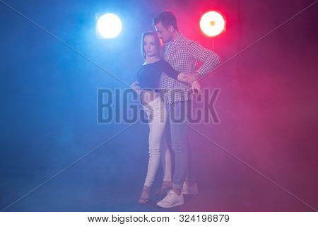 Social Dance, Kizomba, Salsa And Semba Concept - Young Beautiful Couple Dancing Bachata Or Salsa In 