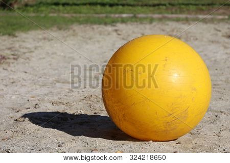 Yellow Colored Physioball On The Sand During  Training For Beginner Riders And Horses At Rural Ridin