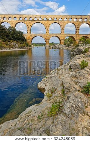 Remoulins, France, September 20, 2019 : The Pont Du Gard, The Highest Roman Aqueduct Bridge, And One