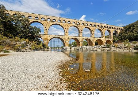 Remoulins, France, September 20, 2019 : The Pont Du Gard, The Highest Roman Aqueduct Bridge, And One