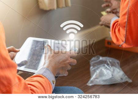 Internet Technician Man Checking Speedtest Upload And Download With Tablet, Home It Network Concept