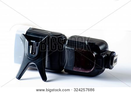 The Camera Flash Is Isolated On A White Background