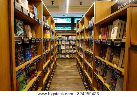 Seattle,wa/usa-9/15/19: An Aisle Of Wooden Book Shelves At The Original University District  Amazon 