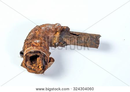 Fragments Of Old Cast-iron Water Pipes On White Background. After Many Years Of Operation Corroded M