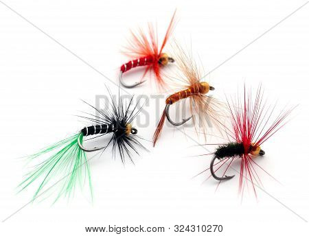 Fishing Flies Of Diffrent Colors With Hooks Over White Background