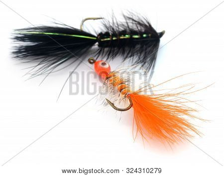 Fishing Flies Of Diffrent Colors With Hooks Over White Background