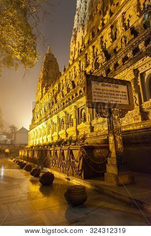 The Place Of An Enlightenment Of Buddha, Mahabodhi Temple And Stupas In Beams Of Night Illumination 