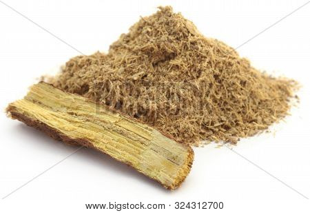 Liquorice Stick And Ground Powder Over White