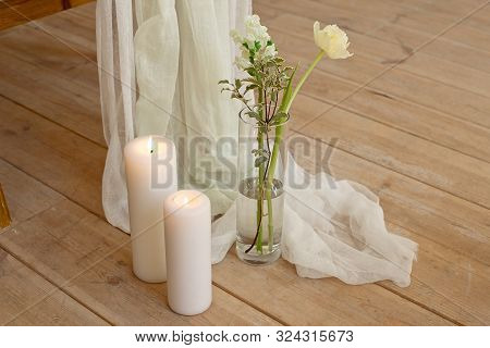 Branch Of Blooming White Peony Tulip Mattiola Branch In A Glass Vase White Wax Candles Stand On The 