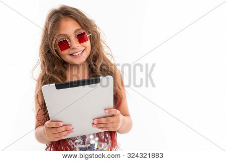 Smiling Girl In Square Red Sunglasses Holding White Tablet Screen Against White Background Isolated