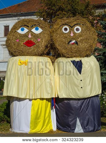 Giant Funny Autumn Decorations With Straw Bales