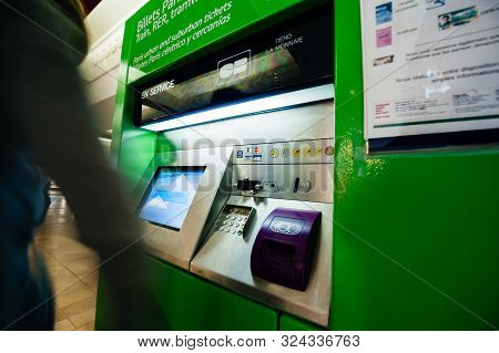 Paris, France - Jul 14, 2011: Silhouetes Of Woman Buyuing Purchaisng Tickets For Metro Rer Tramway T