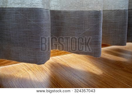 Cotton Curtain Near The Wooden Floor On Which The Golden Sunlight Reflection Luxury Silk