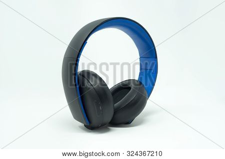 Black And Blue Foldable Over The Ear Headphones. Isolated On A White Background.