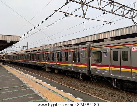 Jakarta, Indonesia - August 8, 2019: A Commuter Line Train Arrives At Bojong Indah Station.