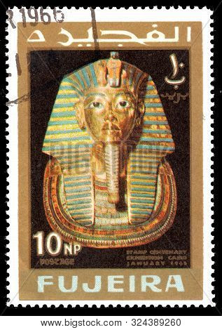 Fujeira - Circa 1966: A Stamp Printed In Fujeira Shows  Mask Of Tutankhamen With Inscription And Nam