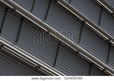 Close-up Of Ground View Of Corrugated Wall With Metal Level Dividers