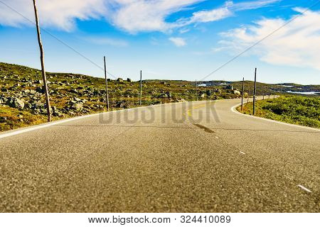 Road Crossing Hardangervidda Plateau, Norway Landscape. National Tourist Hardangervidda Route.