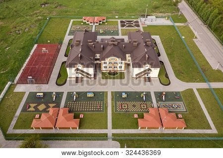 Aerial View Of New Prescool Building In Residential Rural Area.