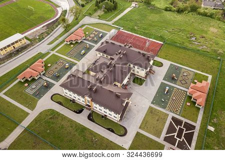 Aerial View Of New Prescool Building In Residential Rural Area.