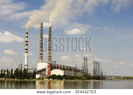 Thermal Power Station Tall Pipes With Thick Smoke Reflected In Lke Water Surface. Pollution Of Envir