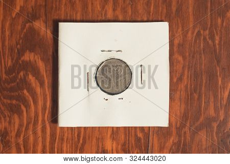Monterrey, Mexico - Sept 8, 2019: Cuban Currency, Cuc, Worth Twenty Five Cents, On A Wooden Desktop.