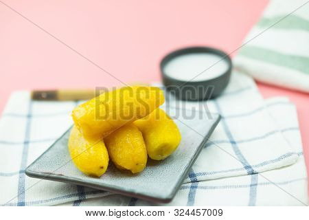 Golden Banana In Syrup (kluay Khai Cheuam) Served With Coconut Milk Cream, Thailand Dessert