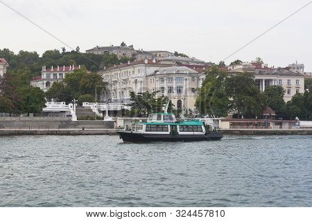 Sevastopol, Crimea, Russia - July 24, 2019: Molodyozhniy Passenger Motor Ship Passes Along The Artil