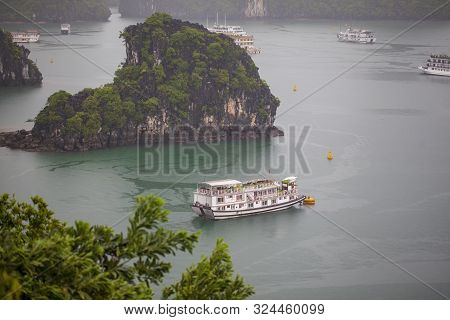 Halong Bay Traditional Fishing Boats, Unesco World Natural Heritage, Vietnam. Tourist Cruise Ships S