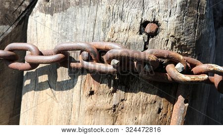 Rusted Chain With Many Big Rings To Moor The Boat