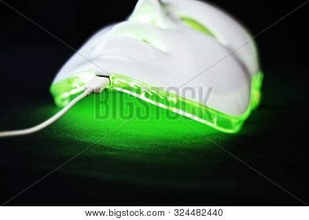 Light Rejuvenating Mask For Facial Skin Therapy On Black Background
