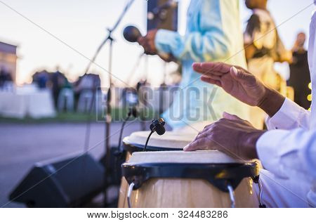 Cuban Performers Playing Latino Rythms During Outdoor Party. Selective Focus