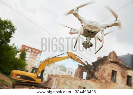 Drone operated by construction worker on building site