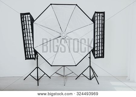 Flash On A White Background In The Photo Studio Equipment